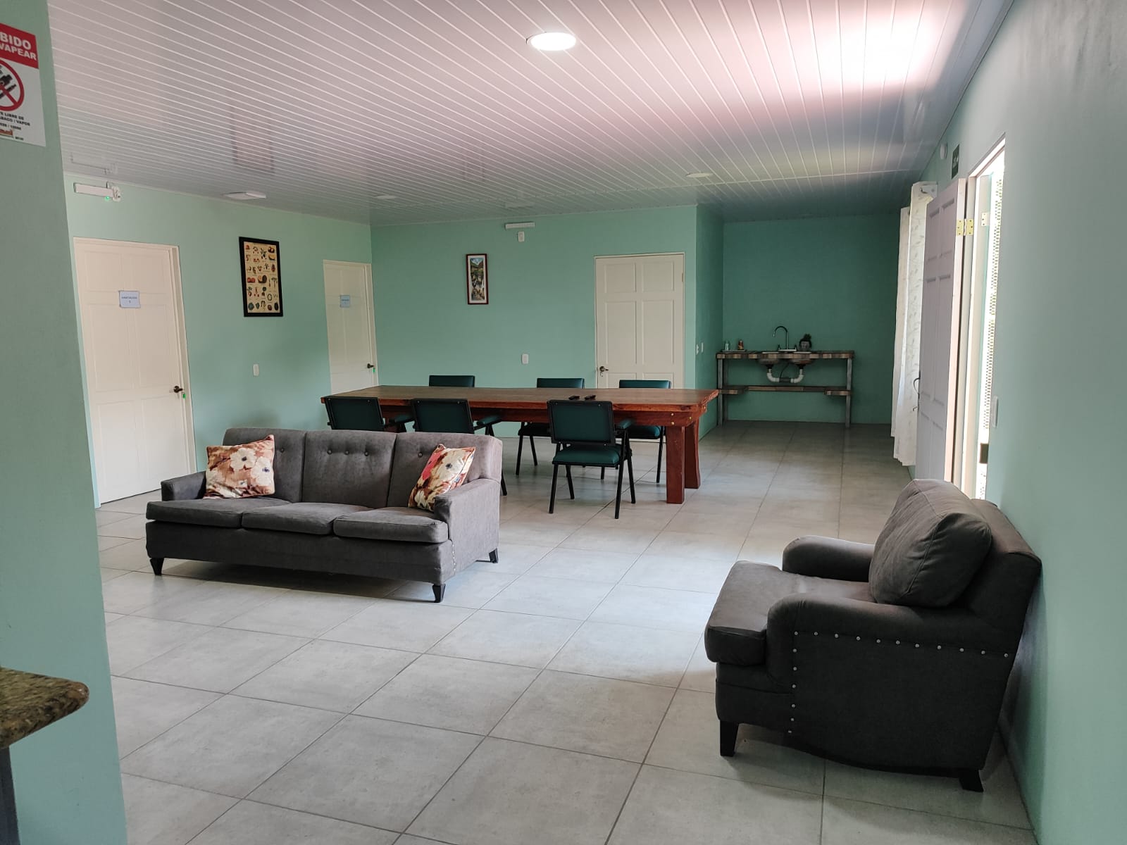Main common room with sofas and dining table