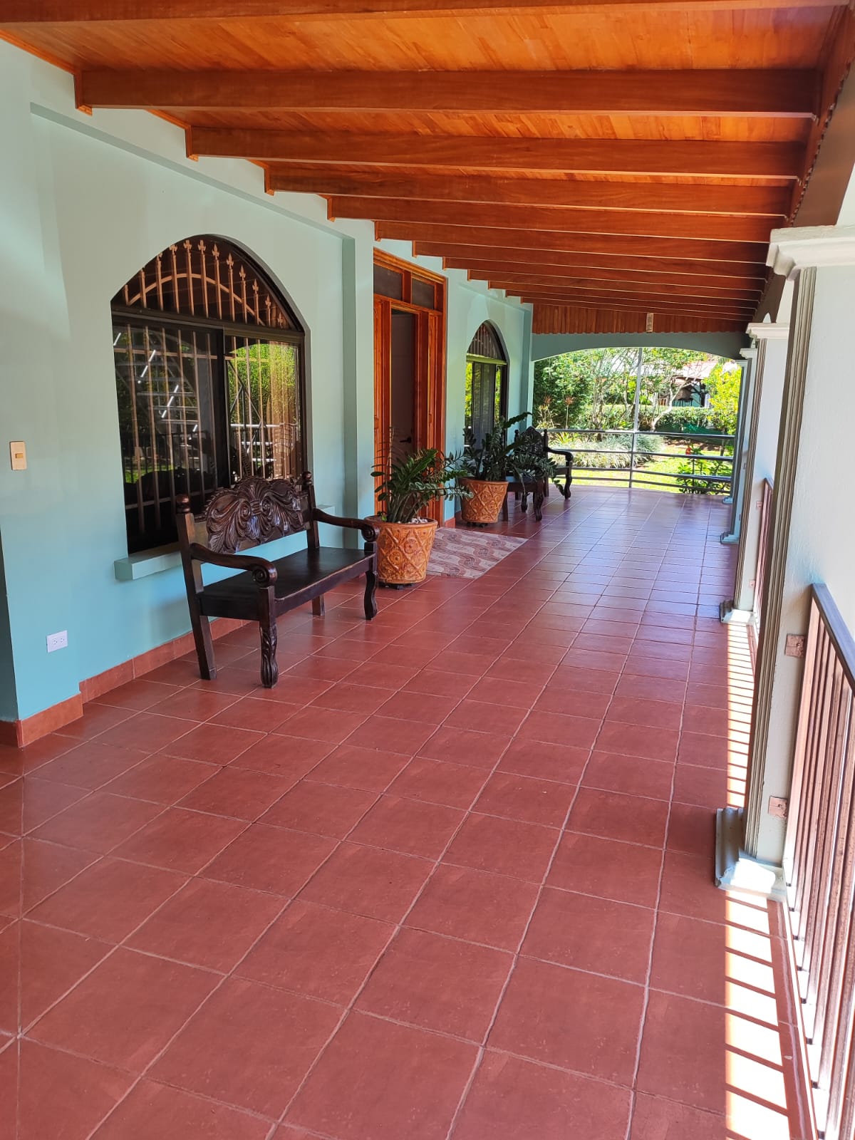Covered walkway corridor with wooden ceiling